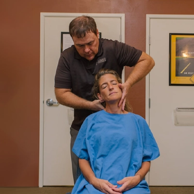 Chiropractor Mesa AZ Aaron Shapiro Adjusting Patients Neck